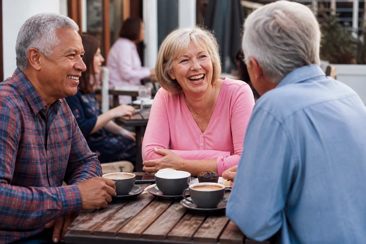 Mature couple talking over coffee in central Christchurch